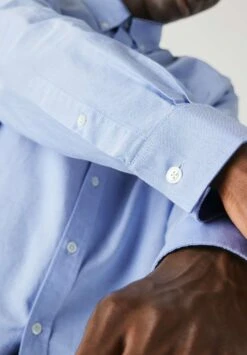 Lacoste Manches Longues - Chemise - Bleu -Tenue Sport Homme Magasin 371d3e7abf3f4497903a3409668aba01