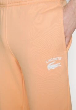 Lacoste Pantalon De Survêtement - Orange Clair 17 Lacoste Pantalon De Survêtement - Orange Clair -Tenue Sport Homme Magasin 5c4b6bb5ebb446699c012ae3c377e8e9