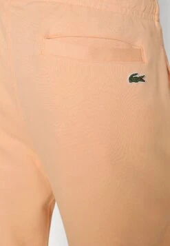 Lacoste Pantalon De Survêtement - Orange Clair 14 Lacoste Pantalon De Survêtement - Orange Clair -Tenue Sport Homme Magasin 8dc992118033459597e5228dfcafbb9f
