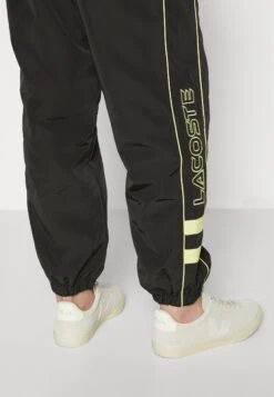 Lacoste Pantalon De Survêtement - Black/Limeira -Tenue Sport Homme Magasin 8e6df5d0e30c4d768a9e4326496229dd