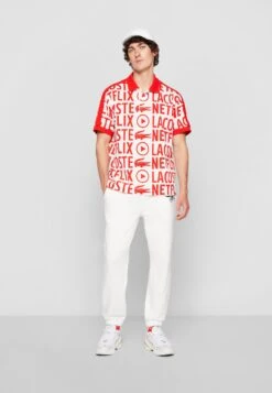 Lacoste X Netflix - Polo - Flour/Corrida 13 Lacoste X Netflix - Polo - Flour/Corrida -Tenue Sport Homme Magasin ca97031efce646c48d6dd2c0f7319472