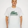 Lacoste T-Shirt Imprimé - White -Tenue Sport Homme Magasin e9fc01fb07b943529d46d0f9ec0af297